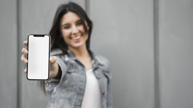 smiling-young-woman-showing-smartphone_23-2147960664
